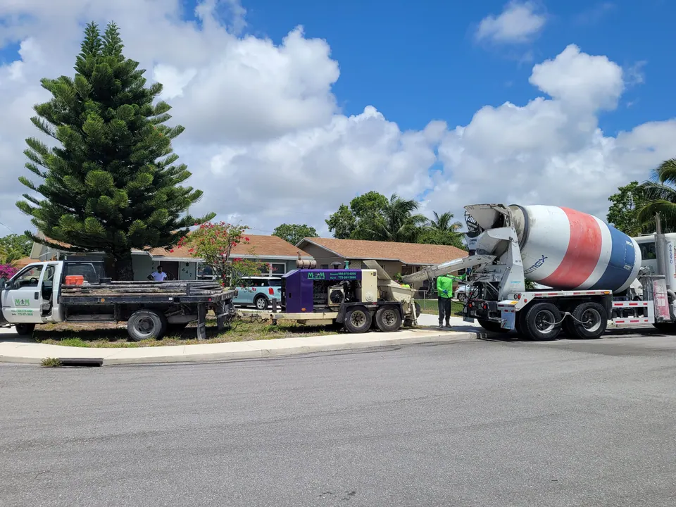 Trailer line pump and mixer truck on a residential street
